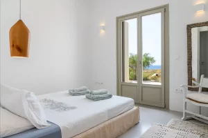 view of the second bedroom showing the amazing sea view and the balcony doors