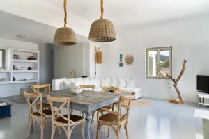 The inside dining area and the living room space of the house