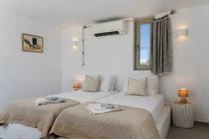 Third bedroom on the upper floor. Two single beds with their bedside tables that can come closer together, if one wants to, and form a bigger double bed.